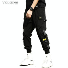 Cargar imagen en el visor de la galería, Pantalones Harem negros de estilo Hip Hop para hombre, pantalones Punk con cintura elástica y cintas, pantalones informales ajustados para correr, pantalones de Hip Hop para hombre